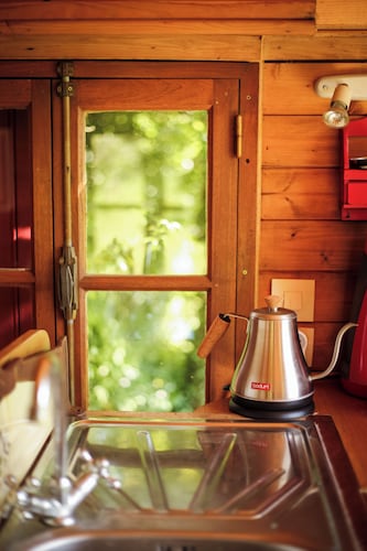 1946 "Pacouli" caravan in a wooded meadow