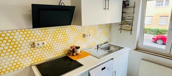 Central 1-room apartment kitchen, washing machine, parking space, flexible sleeping area