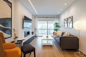 Apartment, 2 Bedrooms, Kitchen, City View | Living room | 50-inch Smart TV with digital channels, streaming services