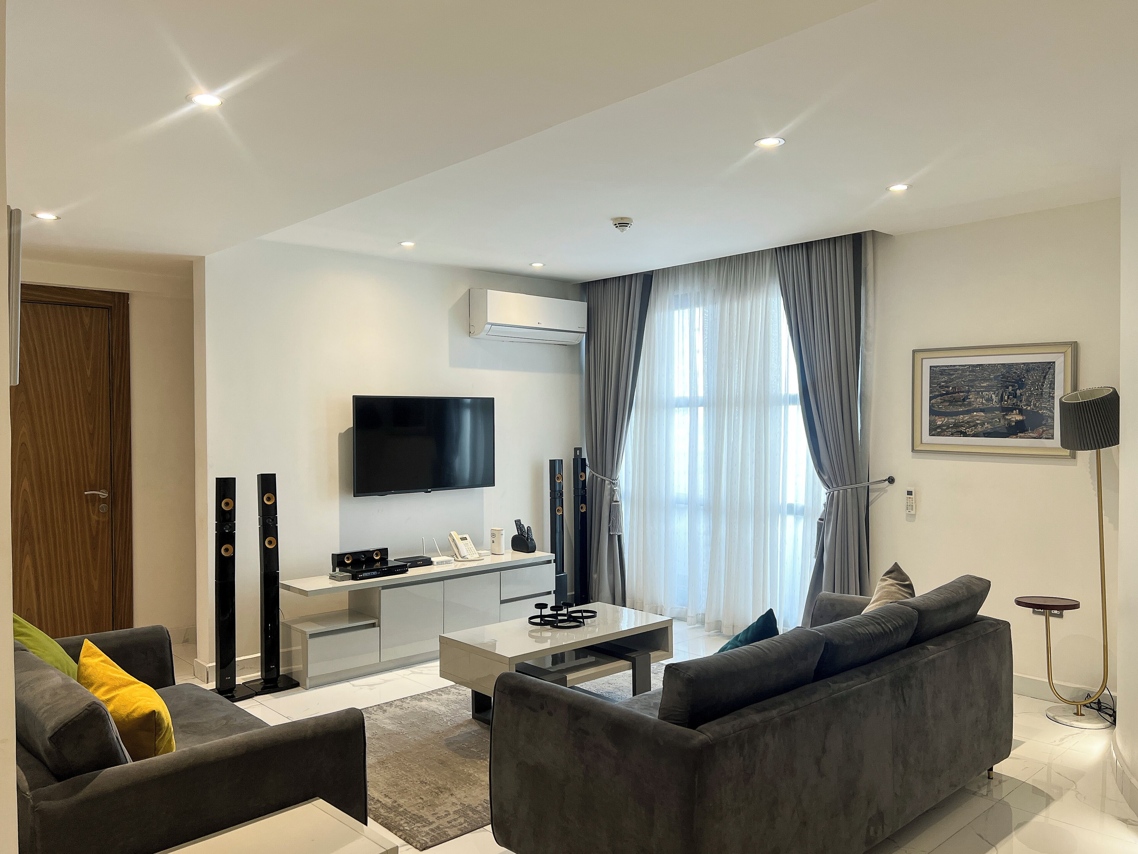 Family Apartment, City View | Living area | 55-inch Smart TV with cable channels, DVD player