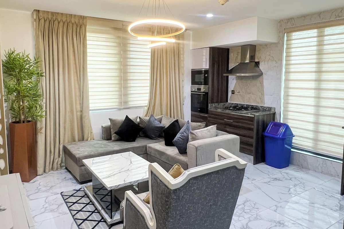 Luxury Apartment | Living area | 55-inch Smart TV with cable channels, DVD player