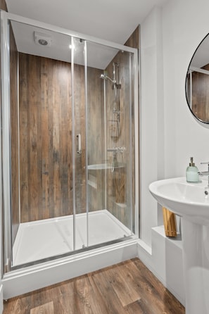 Shower, hair dryer, towels, toilet paper
