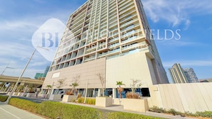 A modern high-rise building with multiple balconies and a flat facade. - Bloomfields Luxurious Stu Maryah Island (Abu Dhabi)