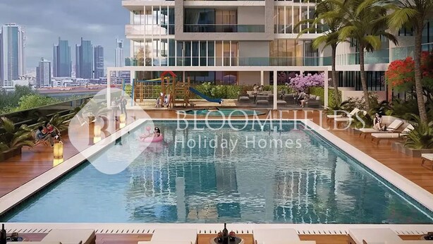 A modern hotel with a rooftop pool, lounge chairs, and a city view. - Bloomfields Luxurious Stu Maryah Island (Abu Dhabi)