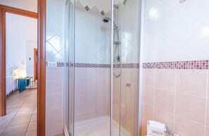 Family Apartment, Multiple Bedrooms, Refrigerator & Microwave (House Sardinia La Dolce Vita) | Bathroom | Shower, hair dryer, bidet, towels