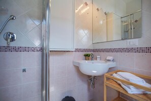Family Apartment, Multiple Bedrooms, Refrigerator & Microwave (House Sardinia La Dolce Vita) | Bathroom | Shower, hair dryer, bidet, towels