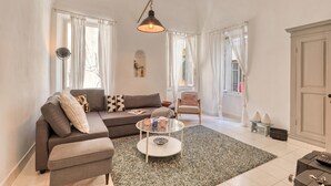A living room with a sofa, armchair, coffee table, and a lamp. - La Casa Della Vikinga With Sea-view Terrace (Sanremo)