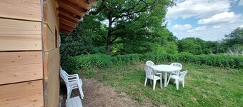 Country cottage surrounded by horses, sheep and rabbits