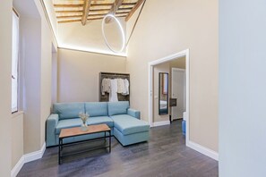 Chambre triple Deluxe | Aire de séjour | Imprimante