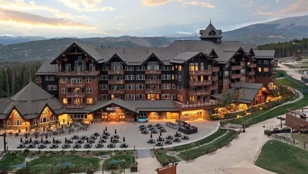 A large lodge with multiple balconies and a spacious outdoor seating area. - Luxury One Ski Hill 2 Bedroom Ski-in/out Condo at Peak 8 (Breckenridge)