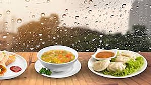 A table with three plates of food: a wrap, a bowl of soup, and dumplings. - HOTEL GOLDEN BIRD (Dhaka)
