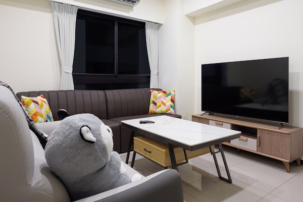 plenty of couch seating, higher coffee table, 65" smart LED TV