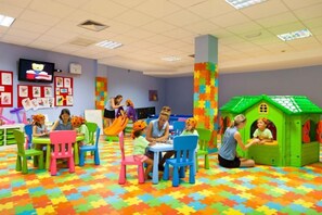 A children's play area with colorful furniture and a playhouse. - Sol Lanzarote All Inclusive (Puerto del Carmen)