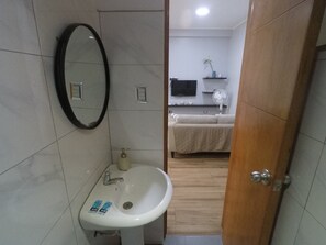 Shower, towels, soap, toilet paper