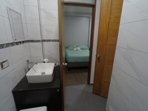 Shower, towels, soap, toilet paper