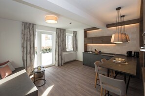 Comfort Apartment, Balcony, Garden View | Living area | 16-inch flat-screen TV with cable channels - Der Zirmhof in Saalbach (Saalbach)