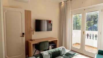 Deluxe Room, Balcony, Park View | In-room safe, desk, laptop workspace, blackout drapes
