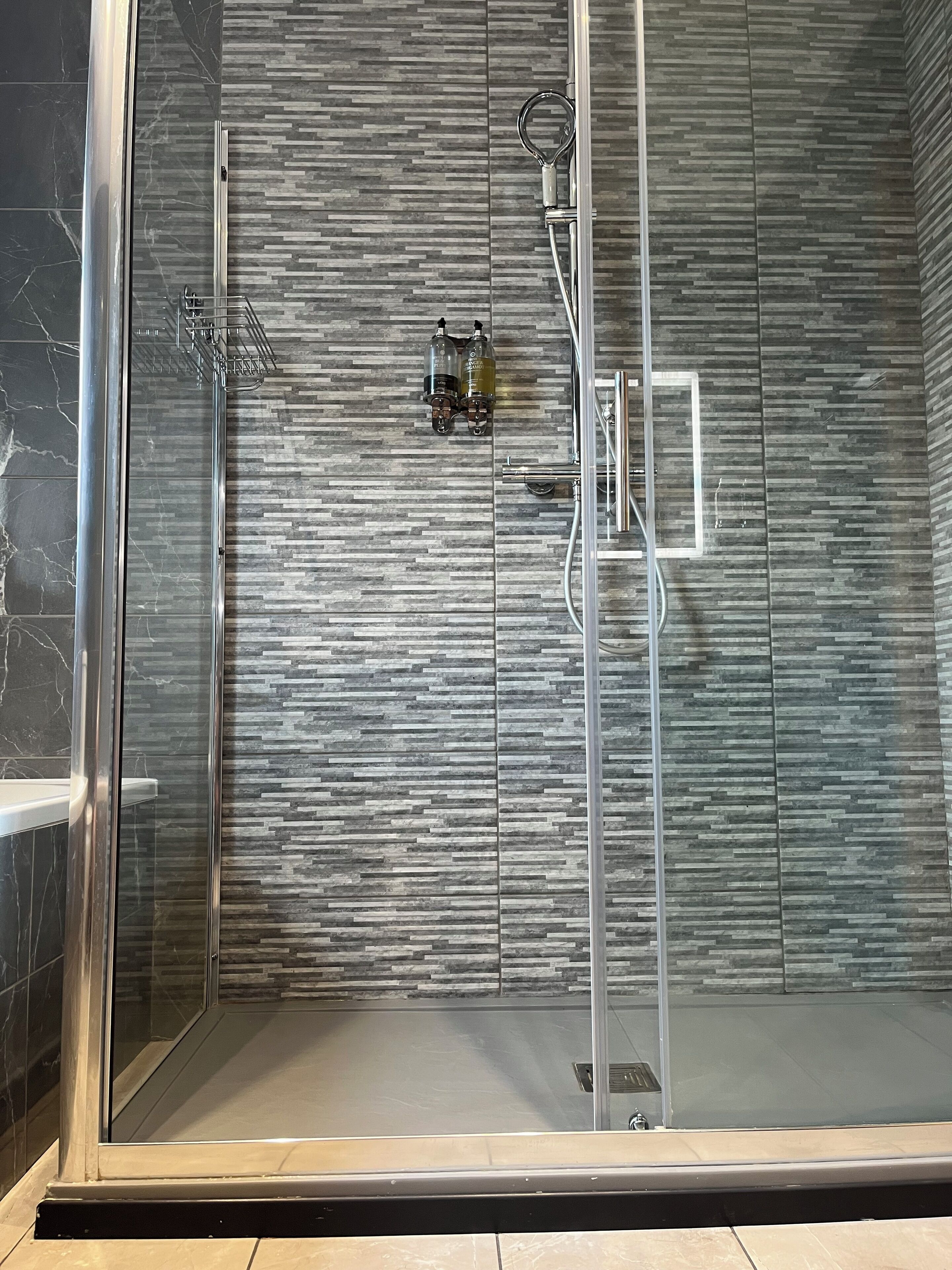 Shower, towels, soap, toilet paper