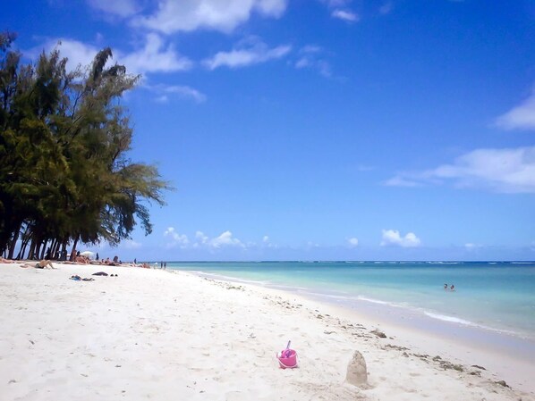 Guests can enjoy a serene beach experience with access to the ocean.