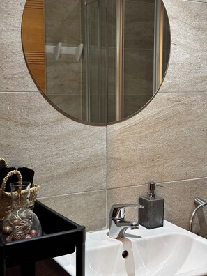 Shower, bidet, towels, soap