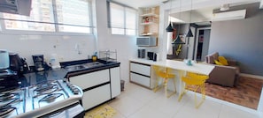 Enjoy cooking and dining in this well-equipped kitchen with a microwave, coffee maker, and sink.