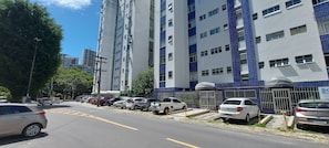 Stylish residential building with balconies and organized parking.