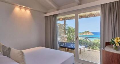 Baia Chia Laguna Resort, Curio Collection by Hilton