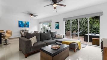 Family Villa | Living area | 65-inch LED TV with cable channels