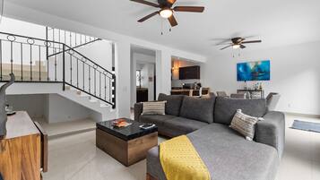 Family Villa | Living area | 65-inch LED TV with cable channels