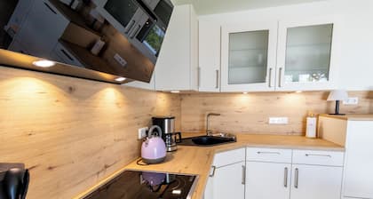 Küstenperle – Dachterrasse. Sauna. Strandnah.