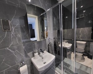 Shower, hair dryer, towels, soap