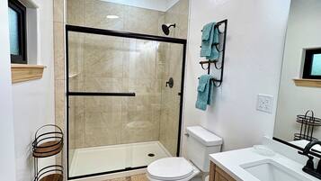 Shower, hair dryer, towels, soap