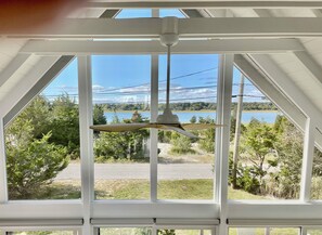 Enjoy a serene view of the surrounding landscape from the large window.