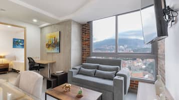 Standard Apartment, City View | Living area | 40-inch Smart TV with cable channels
