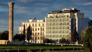 A modern building with a classical column and the name "The Athens Hotel" on the facade. - The Athens Gate Hotel (Athens)