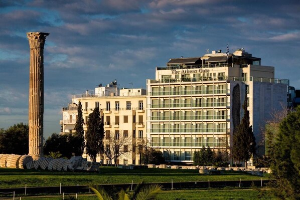 A modern building with a classical column and the name "The Athens Hotel" on the facade. - The Athens Gate Hotel (Athens)