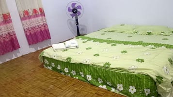 Laptop workspace, blackout curtains, bed sheets