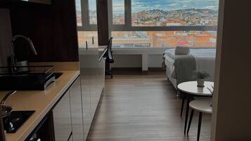 Superior Apartment, City View | Desk, laptop workspace, blackout drapes, soundproofing