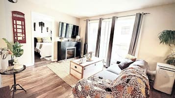 1 bedroom, desk, iron/ironing board, travel crib