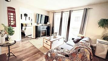 1 bedroom, desk, iron/ironing board, travel crib