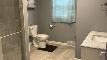 Shower, hair dryer, towels, soap