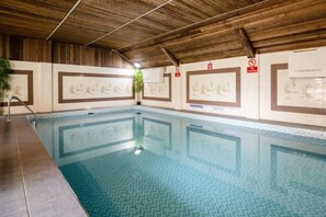 An indoor swimming pool with tiled walls and a wooden ceiling. - Beachcroft Hotel, BW Signature Collection by Best Western (Felpham)