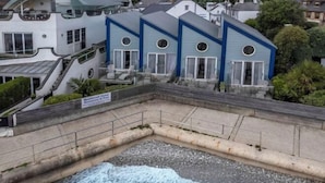A coastal building with a curved roof, a staircase, and a sign indicating a restaurant. - Beachcroft Hotel, BW Signature Collection by Best Western (Felpham)
