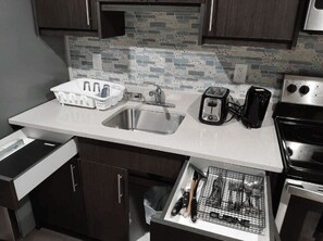 Microwave, oven, stovetop, dishwasher - A cozy one bedroom suite located in the peaceful neighborhood of Evergreen. (Saskatoon)