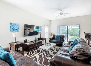 House, Multiple Beds, Pool Access, Garden View (Coco Villa) | Living area | 42-inch flat-screen TV with digital channels - Coco Villa Stay for 10 w/ Resort-style Amenities (Clermont)