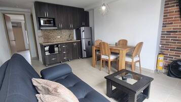 Full-size fridge, microwave, stovetop, rice cooker