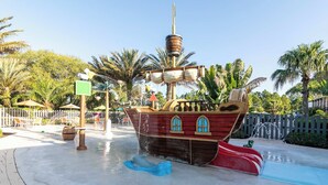 A pirate ship play area with slides and water features. - Dream Days At Enclaves (Davenport)