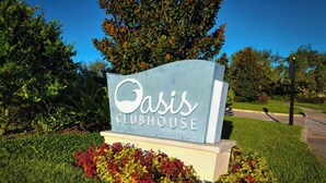 A sign for Oasis Clubhouse at ChampionsGate. - Mickeys Mansion At Championsgate (Davenport)