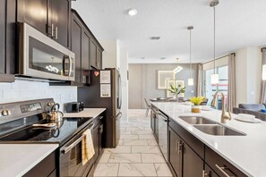 Townhome, Multiple Beds, Pool Access, Pool View (My Happy Place At Championsgate) | Private kitchen | Fridge, microwave, oven, stovetop