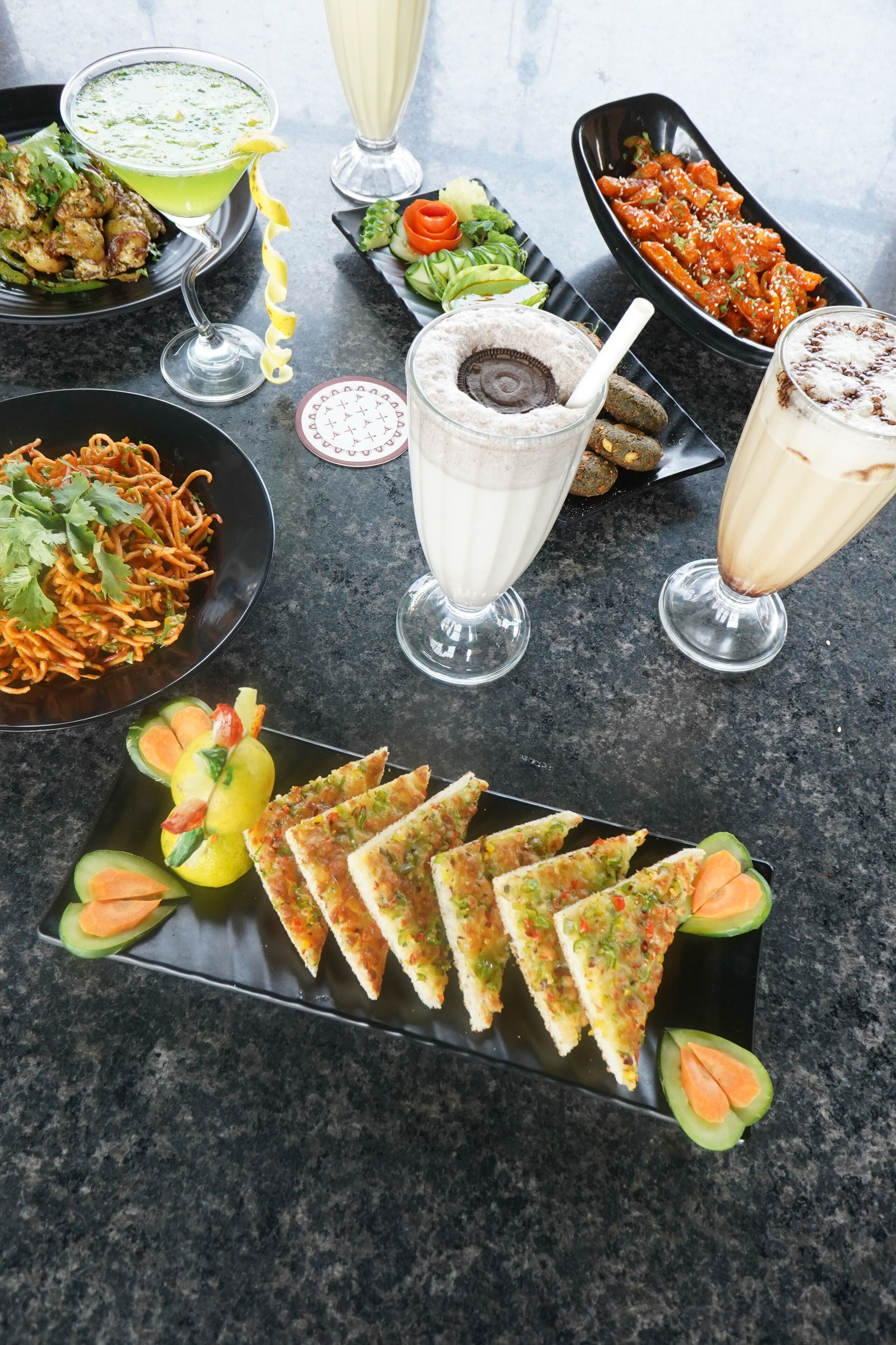 A variety of dishes and drinks on a table.